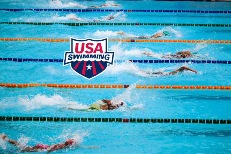 Swimmers racing in a pool with the USA Swimming logo.