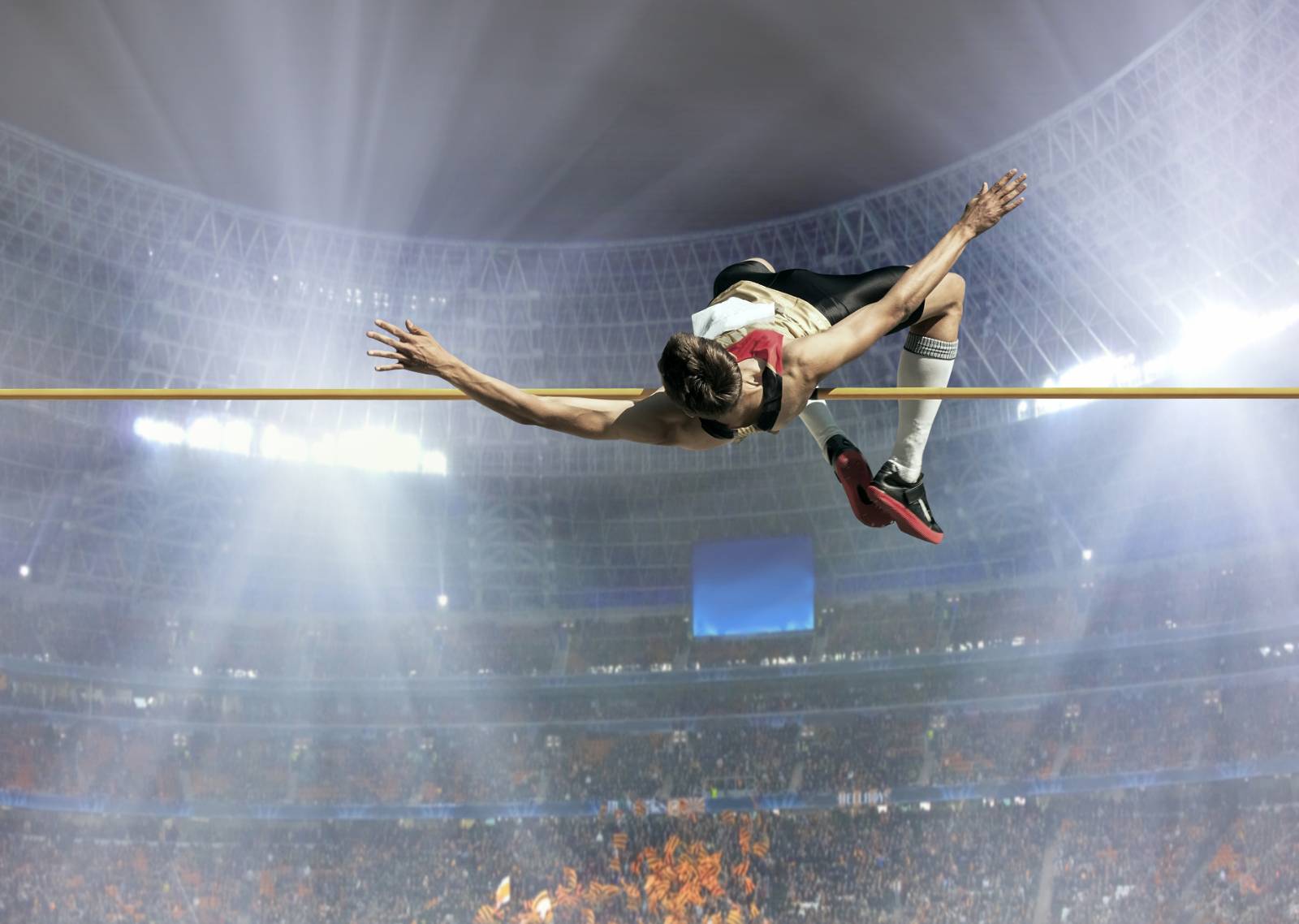 Image of a man during a high jump competition.